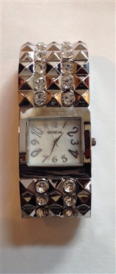 Silver tone watch with crystals throughout the stretch band