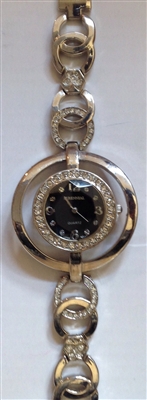 Silver tone circular watch with crystals