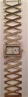 Gold tone watch with crystal embellishment